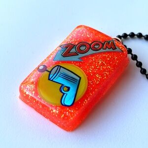 Zoom Orange Glitter Phone Charm